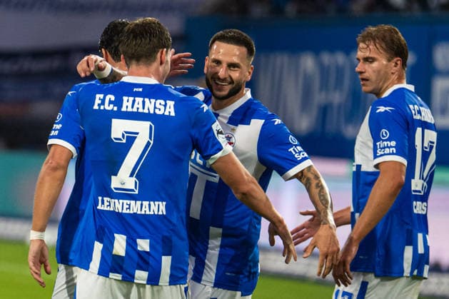 Rostock, Germany, September 16, 2026, 3. Liga 2026–2027, Matchday 6: FC Hansa Rostock vs. VfB Stuttgart II. Pictured, third from left: Leon Dajaku of Hansa Rostock celebrates after scoring the 1–0 goal with, from left, Bernie Lennemann of Hansa Rostock and Florian Carstens of Hansa Rostock. DFB and DFL regulations prohibit any use of photographs as image sequences and or quasi-video content. Copyright: xFotostandx xVoelkerx