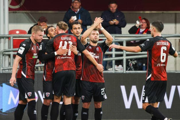 Celebration after the goal—Nishan Velupillay (FC Ingolstadt 04, No. 28) scores to make it 0–1, with Yannick Deichmann (FC Ingolstadt 04, No. 20), Vinko Sapina (FC Ingolstadt 04, No. 41), and Georgios Antzoulas (FC Ingolstadt 04, No. 6) during the match between FC Ingolstadt 04 and TSG Hoffenheim II on September 16, 2026, DFB regulations prohibit any use of photographs as image sequences and or quasi-video. GER, Soccer, 3. Liga, Matchday 6, FC Ingolstadt 04 vs. TSG Hoffenheim II, September 16, 2026, Audi Sportpark Ingolstadt Copyright: xEibner-Pressefoto OliverxSTRISCHx EP-OSH