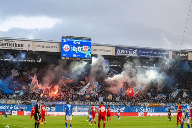 Rostock, Germany, September 16, 2026, 3. Liga 2026–2027, Matchday 6: FC Hansa Rostock vs. VfB Stuttgart II. Pictured: Choreographed display with pyrotechnics in the South Stand. DFB and DFL regulations prohibit any use of photographs as image sequences and or quasi-video. Copyright: xFotostandx xVoelkerx