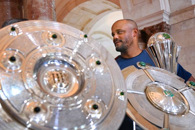 Coach Vincent KOMPANY of Bayern Munich with the trophies, cups, and awards won during the 2025–26 season,Championship Trophy, DFB Cup, Super Cup—Markus SÖDER, Minister-President of Bavaria and CSU Chairman, welcomes the championship teams of FC Bayern Munich to the Kuppelsaal at the State Chancellery in Munich on September 16, 2026