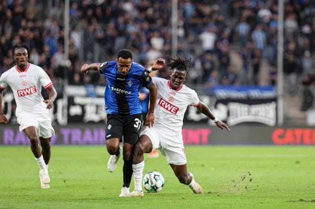 Noah Sarenren Bazee of SV Waldhof Mannheim, 37, and Franci Bouebari of Rot Weiss Essen, 19; SV Waldhof Mannheim vs. Rot Weiss Essen on September 16, 2026, in Mannheim at Carl Benz Stadium. Photo by Alfio Marino Copyright: