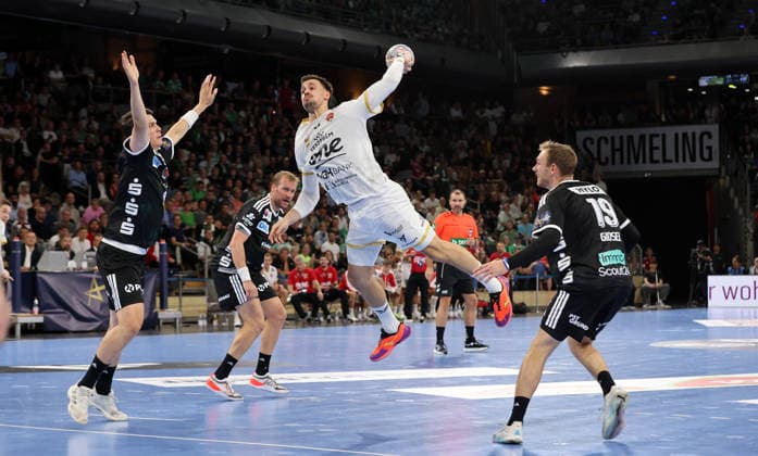 Frederik Simak, Ivan Martinovic with the ball, Mathias Gidsel in a duel—game scene, action, sports, handball, Champions League, Men’s Champions League, Matchday 2, 2026–2027 season, September 16, 2026, Füchse Berlin vs. One Veszprém HC at the Max Schmeling Halle