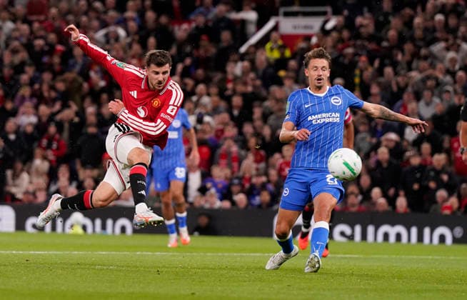 Manchester, England, 16th September 2026. Mason Mount of Manchester United, ManU (L) scores the second goal during the Manchester United vs Brighton and Hove Albion Carabao Cup match at Old Trafford, Manchester. Picture credit should read: Andrew Yates Sportimage EDITORIAL USE ONLY. No use with unauthorised audio, video, data, fixture lists, club league logos or live services. Online in-match use limited to 120 images, no video emulation. No use in betting, games or single club league player publications. SPI_001_AY_MAN_UTD_BRIGHTON SPI-5001-0001