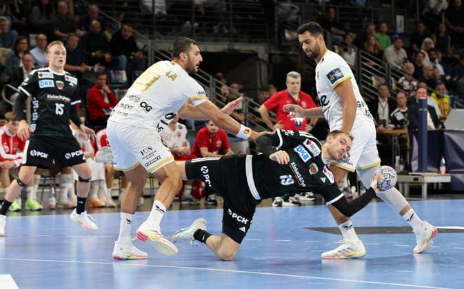Yehia Mohammed Elderaa, Mathias Gidsel with the ball, Ahmed Heshem Elsayed Moham, tackle, game action, sports, handball, Champions League, Men s Champions League, Matchday 2, 2026–2027 season, September 16, 2026, Füchse Berlin vs. One Veszprém HC at the Max Schmeling Halle