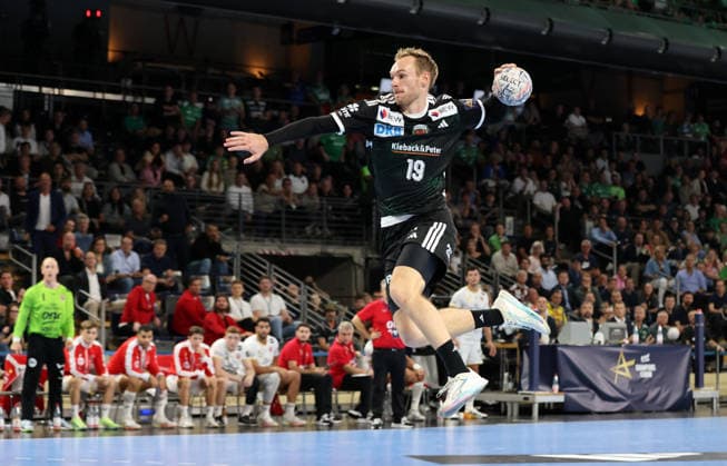 Mathias Gidsel scores a goal against goalkeeper Emil Nielsen. Game highlight. Action. Sports. Handball. Champions League. Men s Champions League, Matchday 2, 2026–2027 season, September 16, 2026. Füchse Berlin vs. One Veszprem HC at the Max Schmeling Halle.