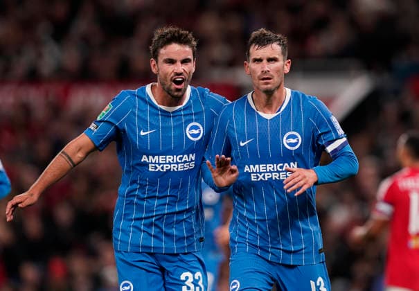 Manchester, England, 16th September 2026. Pascal Grob of Brighton (r) celebrates scoring (2-2) during the Manchester United, ManU vs Brighton and Hove Albion Carabao Cup match at Old Trafford, Manchester. Picture credit should read: Andrew Yates Sportimage EDITORIAL USE ONLY. No use with unauthorised audio, video, data, fixture lists, club league logos or live services. Online in-match use limited to 120 images, no video emulation. No use in betting, games or single club league player publications. SPI_035_AY_MAN_UTD_BRIGHTON SPI-5001-0036