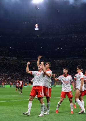 AC Milan v Benfica - UEFA Europa League - Season 2026-2027 Milan, Italy, 16th September 2026. Jakub Kaminski of SL Benfica celebrates with team mates Georgiy Sudakov, Tomas Araujo and Joao Palhinha after scoring to give the side a 2-0 lead during the AC Milan vs SL Benfica UEFA Europa League, League Phase match at Giuseppe Meazza, Milan. Picture credit should read: Jonathan Moscrop Milan Stadio Giuseppe Meazza Italy