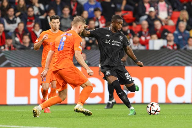 Artemijus Tutyökinas of NK Celje and Christian Kofane of Bayer 04 Leverkusen battle for the ball during the UEFA Europa League 2026–27 group stage match between Bayer 04 Leverkusen and NK Celje at BayArena on September 16, 2026 in Leverkusen, Germany. Photo by Oliver Kaelke, DeFodi Images