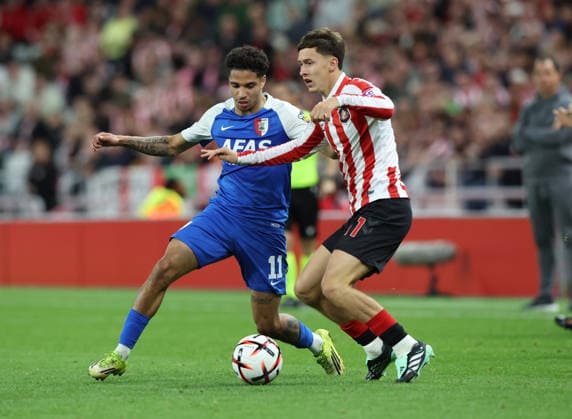 Sunderland, England, 16th September 2026. Ro-Zangelo Daal (L) of AZ Alkmaar in action with Chris Rigg of Sunderland during the Sunderland vs AZ Alkmaar UEFA Europa League match at the Stadium Of Light, Sunderland. Picture credit should read: Nigel Roddis Sportimage EDITORIAL USE ONLY. No use with unauthorised audio, video, data, fixture lists, club league logos or live services. Online in-match use limited to 120 images, no video emulation. No use in betting, games or single club league player publications. SPI_023_NR_SUND_AZAL SPI-5002-0023