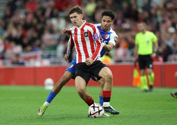 Sunderland, England, 16th September 2026. Ro-Zangelo Daal (R) of AZ Alkmaar in action with Chris Rigg of Sunderland during the Sunderland vs AZ Alkmaar UEFA Europa League match at the Stadium Of Light, Sunderland. Picture credit should read: Nigel Roddis Sportimage EDITORIAL USE ONLY. No use with unauthorised audio, video, data, fixture lists, club league logos or live services. Online in-match use limited to 120 images, no video emulation. No use in betting, games or single club league player publications. SPI_024_NR_SUND_AZAL SPI-5002-0024