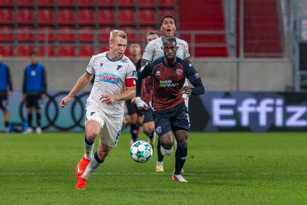 Ingolstadt, Germany, August 8, 2026, 3rd League 2026–2027, Matchday 6: FC Ingolstadt 04 vs. TSG Hoffenheim II. Pictured from left, in a tackle: Valentin Lässig (TSG II) and Josef Ganda (FCI). DFB and DFL regulations prohibit any use of photographs as image sequences and or quasi-video. Audi Sportpark Bayern Copyright: xFotostandx xSchäferx