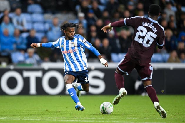 Coventry, England, 16th September 2026. Yann Gboho of Coventry City passes the ball under pressure during the Coventry City vs Aston Villa Carabao Cup match at the Coventry Building Society Arena, Coventry. Picture credit should read: Harriet Massey Sportimage EDITORIAL USE ONLY. No use with unauthorised audio, video, data, fixture lists, club league logos or live services. Online in-match use limited to 120 images, no video emulation. No use in betting, games or single club league player publications. SPI_066_HM_COV_v_Villa_160926 SPI-5000-0057