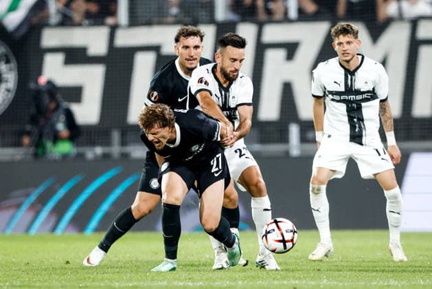 SOCCER - UEFA EL, Sturm vs Rennais GRAZ,AUSTRIA,16.SEP.26 - SOCCER - UEFA Europa League, Sturm Graz vs Stade Rennais FC. Image shows Luis Balbo (Sturm) and Adrien Thomasson (Rennais).  GEPAxpictures xJamesxDoak