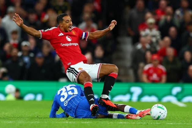 MANCHESTER, ENGLAND - SEPTEMBER 16: Malick Yalcouyé of Brighton & Hove Albion fouls Youri Tielemans of Manchester United, ManU during the Carabao Cup Third Round match between Manchester United and Brighton & Hove Albion at Old Trafford on September 16, 2026 in Manchester, England.  Copyright: xMBxMediax