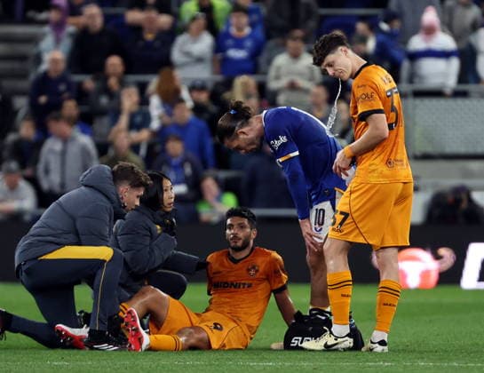 16th September 2026; Everton Stadium, Liverpool, England; Carabao Cup Football, Everton versus Wolverhampton Wanderers; Raul Jimenez of Wolverhampton Wanderers receives treatment before he goes off injured in the first half AlanxMartin