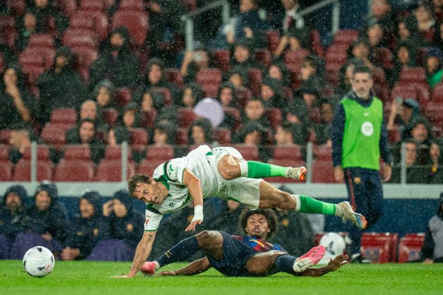(260917) -- BARCELONA, Sept. 17, 2026 -- FC Barcelona, Barca s Karim Adeyemi (bottom) vies with Racing Santander s Sergio Canales during the La Liga football match between FC Barcelona and Racing Santander in Barcelona, Spain, on Sept. 16, 2026. (Photo by Xinhua) (SP)SPAIN-BARCELONA-FOOTBALL-LA LIGA-BARCELONA VS RACING SANTANDER JoanxGosa 
