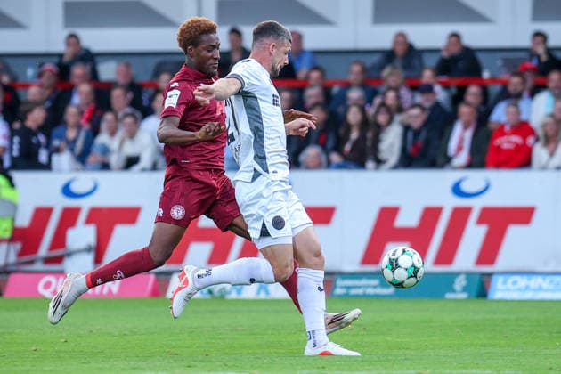 September 16, 2026, xsefx, Soccer, SC Fortuna Köln vs. SV Wehen Wiesbaden, 3rd Division, South Division, Matchday 6, 2026–2027 Season Jordy Gillekens of SV Wehen Wiesbaden (No. 27) in a tackle against Romeo Aigbekaen of Fortuna Cologne (No. 30) DFB regulations prohibit any use of photographs as image sequences and or quasi-video North Rhine-Westphalia, Germany