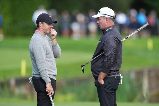 VIRGINIA WATER, ENGLAND - SEPTEMBER 17: Ryan Fox (NZL) speaks with Rory McIlroy (IRE) on the eighteenth green during Round 1 at the BMW PGA, Golf Herren Championship at Wentworth Golf Club, Virginia Water on September 17, 2026 in Surrey, England The BMW PGA Championship