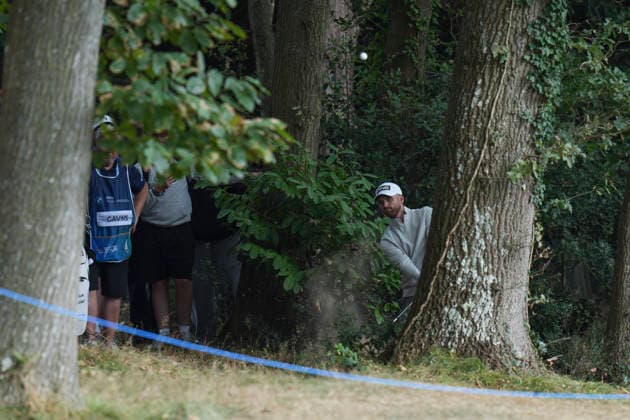 VIRGINIA WATER, ENGLAND - SEPTEMBER 17: Daniel Gavins (ENG) plays from the trees on the first hole during Round 1 at the BMW PGA, Golf Herren Championship at Wentworth Golf Club, Virginia Water on September 17, 2026 in Surrey, England The BMW PGA Championship