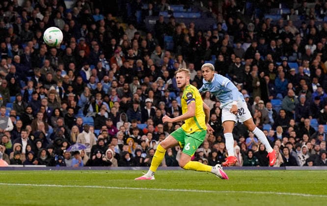Manchester, England, 17th September 2026. Rico Lewis of Manchester City has a shot which goes wide during the Manchester City vs Norwich City Carabao Cup match at the Etihad Stadium, Manchester. Picture credit should read: Andrew Yates Sportimage EDITORIAL USE ONLY. No use with unauthorised audio, video, data, fixture lists, club league logos or live services. Online in-match use limited to 120 images, no video emulation. No use in betting, games or single club league player publications. SPI_016_AY_Man_City_Norwich SPI-5003-0016