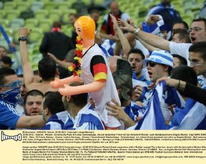 Football, EURO 2012, Greek fans with a Merkel rubber doll