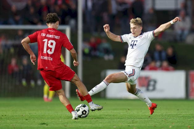 September 18, 2026, Men s, Soccer, 2026–2027 season, Bavarian Regional League, Matchday 10: TSV Aubstadt vs. FC Bayern Munich II; Maximilian Eckstein (19) for TSV Aubstadt and Anton Heinz (9) for FC Bayern Munich II; Sulzfeld Schulstadion, Aubstadt; NGN Arena; Bavaria, Germany