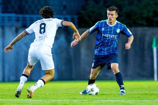 September 18, 2026, KWilkowski, Soccer, Regionalliga West, SV Rödinghausen vs. FC Gütersloh, Häcker Wiehenstadion, Matchday 9, 2026–2027 season: Aleksandar Kandic of FC Gütersloh (No. 27) in a tackle against Mika Polat of SV Rödinghausen (No. 8). DFB regulations prohibit any use of photographs as image sequences and or quasi-video. North Rhine-Westphalia, Germany