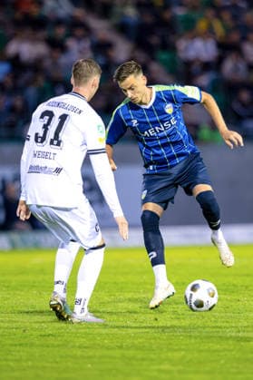 September 18, 2026, KWilkowski, Soccer, Regionalliga West, SV Rödinghausen vs. FC Gütersloh, Häcker Wiehenstadion, Matchday 9, 2026–2027 Season: Patrik Twardzik of FC Gütersloh (18) in a tackle against Henri Weigelt of SV Rödinghausen (31). DFB regulations prohibit any use of photographs as image sequences and or quasi-video. Photo: xKamilxWilkowskixPressefotoKochx, North Rhine-Westphalia Germany