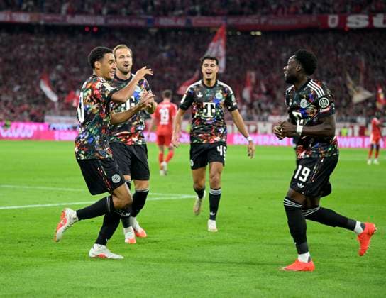 September 18, 2026, 2026–2027 Bundesliga Season, Matchday 4, FC Bayern Munich vs. 1. FC Union Berlin, at the Allianz Arena in Munich, goal celebrations by Jamal Musiala (Bayern Munich), Harry Kane (Bayern Munich), Aleksandar Pavlovic (Bayern Munich), and Alphonso Davies (Bayern Munich)