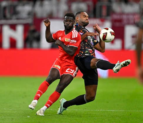 September 18, 2026, 2026–2027 Bundesliga Season, Matchday 4, FC Bayern Munich vs. 1. FC Union Berlin, at the Allianz Arena in Munich, from left: Emmanuel Latte (1. FC Union Berlin) vs. Jonathan Tah (FC Bayern Munich)