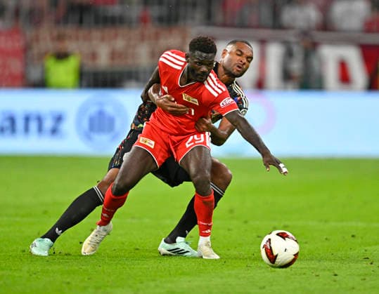 September 18, 2026, 2026–2027 Bundesliga, Matchday 4, FC Bayern Munich vs. 1. FC Union Berlin, at the Allianz Arena in Munich, from left: Emmanuel Latte (1. FC Union Berlin) vs. Jonathan Tah (FC Bayern Munich)