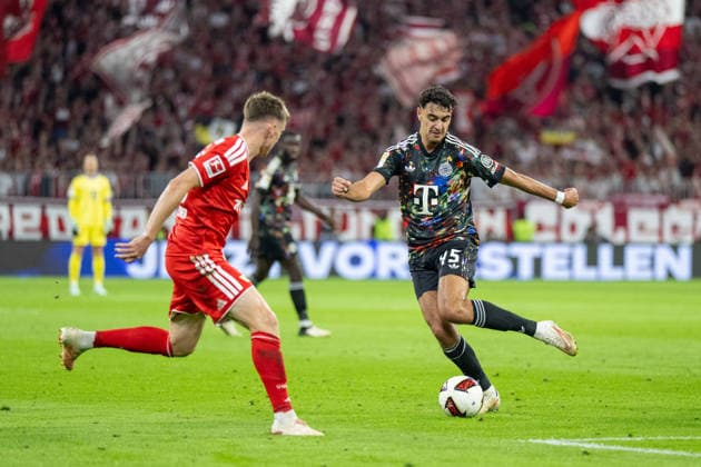 Aleksandar Pavlovic 45, FC Bayern Munich in a tackle; FC Bayern Munich 1, FC Union Berlin; Bundesliga; Matchday 4; September 18, 2026. DFB regulations prohibit any use of photographs as image sequences and or quasi-video. Munich, Bayern, Germany Copyright: xkolbert-press UlrichxGamelx