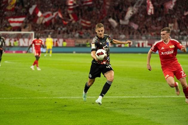 September 18, 2026: FC Bayern Munich vs. Union Berlin, Matchday 4 of the Bundesliga at the Allianz Arena in Munich; Josip Stanisic (FC Bayern Munich), 44, vs. Michel Aebischer (Union Berlin), 20 IMPORTANT NOTICE: In accordance with DFL and DFB regulations, it is prohibited to use or allow the use of photographs taken in the stadium and or during the game in the form of sequential images and or video-like photo series. Copyright: xJamesxZabelx