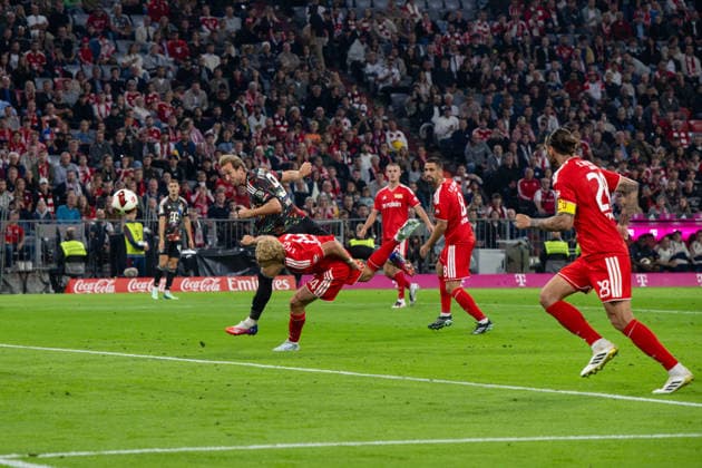 Soccer, Men s, 2026–2027 Season, Bundesliga 1, Matchday 4, FC Bayern Munich vs. 1. FC Union Berlin; Harry Kane of Bayern Munich scores the goal to make it 4–0 against Leopold Querfeld of 1. FC Union Berlin and Rani Khedira of 1. FC Union Berlin, September 18, 2026, Copyright: xMatthiasxKochx