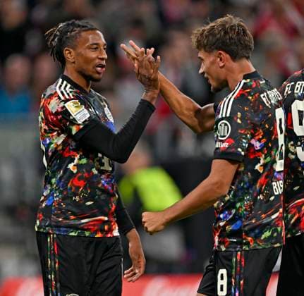 September 18, 2026, 2026–2027 Bundesliga Season, Matchday 4, FC Bayern Munich vs. 1. FC Union Berlin, at the Allianz Arena in Munich; from left: Michael Olise (FC Bayern Munich) and Tom Bischof (FC Bayern Munich) celebrate