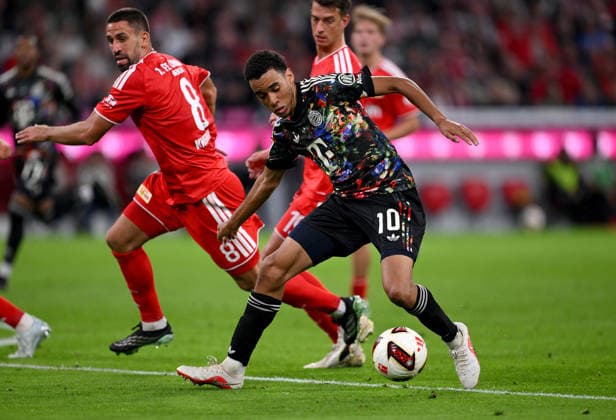 Soccer, Bundesliga 1, 2026–2027 Season, Matchday 4, September 18, 2026: FC Bayern Munich vs. 1. FC Union Berlin—Rani Khedira (left) of 1. FC Union Berlin against Jamal Musiala (right) of FC Bayern Munich