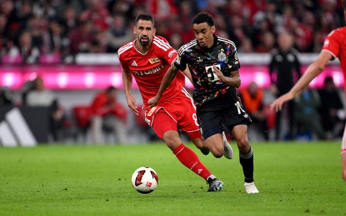 Soccer, Bundesliga 1, 2026–2027 Season, Matchday 4, September 18, 2026: FC Bayern Munich vs. 1. FC Union Berlin—Rani Khedira (left) of 1. FC Union Berlin against Jamal Musiala (right) of FC Bayern Munich