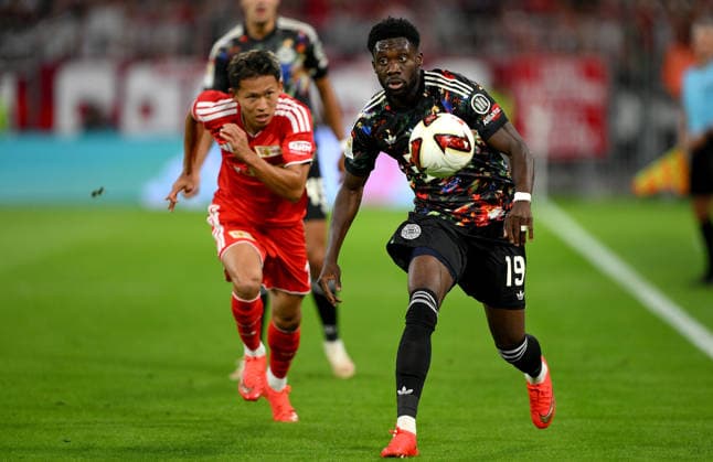 Soccer, Bundesliga 1, 2026–2027 Season, Matchday 4, September 18, 2026: FC Bayern Munich vs. 1. FC Union Berlin—Woo-yeong Jeong (left), 1. FC Union Berlin, vs. Alphonso Davies (right), FC Bayern Munich