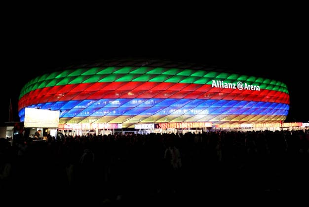 Soccer, Men s, Bundesliga, 2026–2027 Season, FC Bayern Munich vs. 1. FC Union Berlin, Allianz Arena; The Allianz Arena illuminated with special lighting after the game; Olympic bid; Olympics; DFB; DFL regulations prohibit any use of photographs as image sequences and or quasi-video