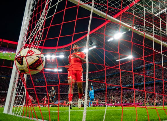 September 18, 2026, 2026–2027 Bundesliga, Matchday 4, FC Bayern Munich vs. 1. FC Union Berlin, at the Allianz Arena in Munich, The ball bounces into the net, Felix Uduokhai of Union Berlin retrieves it