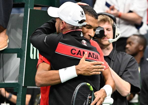 September 18, 2026, Quebec, Pq, Canada: Felix Auger-Aliassime of Canada, right, celebrates his win against Quentin Halys of France with his coach Frank Dancevic during a Davis Cup qualifier second round match at the Videotron Centre in Quebec City, Friday, Sept. 18, 2026. Canada News - September 18, 2026 - ZUMAc35_ 20260918_zaf_c35_137 Copyright: xJacquesxBoissinotx