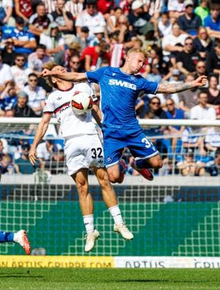 September 19, 2026 Soccer Season 2026–2027, Matchday 2, Bundesliga, Matchday 6: Karlsruher SC (KSC) vs. 1. FC Nürnberg (FCN) Club Sports Photo by Zink DaMa xdaxmax. DFL regulations prohibit any use of photographs as image sequences and or quasi-video For editorial use only. Tim Janisch 32, 1 FC Nürnberg (FCN) in a header duel with Viktor Bergh 33, Karlsruher SC (KSC)