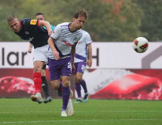 Phil Harres, Holstein Kiel; Jannik Mueller, VfL Osnabrück; Soccer, Men s, 2026–2027 Season, 2. Bundesliga, Holstein Stadium, Holstein Kiel vs. VfL Osnabrück. DFL regulations prohibit any use of photographs as image sequences and or quasi-video.