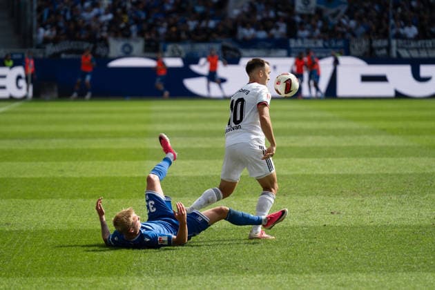 September 19, 2026, xjyhynx, Soccer 2. Bundesliga, Karlsruher SC vs. 1. FC Nürnberg, from left: Viktor Bergh (33, Karlsruher SC) and Julian Justvan (10), 1 FC Nürnberg. DFL and DFB regulations prohibit any use of photographs as image sequences and or quasi-video. Karlsruhe