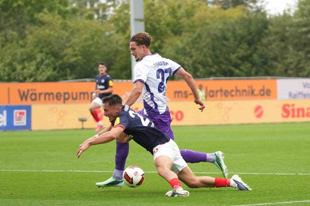 Soccer I Men s I 2026–2027 Season I 2. Bundesliga I Matchday 6 I Holstein Kiel vs. VfL Osnabrück I September 19, 2026 Adrian Kapralik 20, Holstein Kiel falls after a tackle with Robin Fabinski, 27, VfL Osnabrück, Holstein Kiel Stadium, Schleswig-Holstein, Germany Copyright: xLobeca MaschaxHolmx