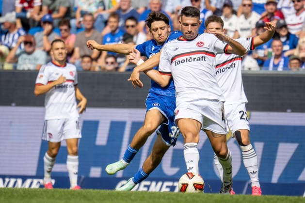September 19, 2026, xdaymx, Soccer 2. Bundesliga, Karlsruher SC 1 FC Nürnberg, Vl Pinto, Rafael Pedrosa, Karlsruher SC in a tackle with Alexios Kalegeropoulos, 1 FC Nürnberg, DFL, DFB. REGULATIONS PROHIBIT ANY USE OF PHOTOGRAPHS as IMAGE SEQUENCES and or QUASI-VIDEO. Karlsruhe