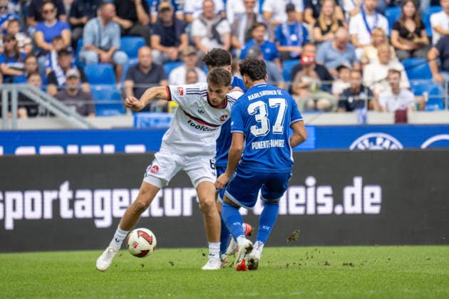 September 19, 2026, xdaymx, Soccer 2. Bundesliga, Karlsruher SC 1 FC Nürnberg: A tackle by Adam Markiev of FC Nürnberg on Ponente Ramirez and Jason of Karlsruher SC. DFL and DFB regulations prohibit any use of photographs as image sequences and or quasi-video. Karlsruhe