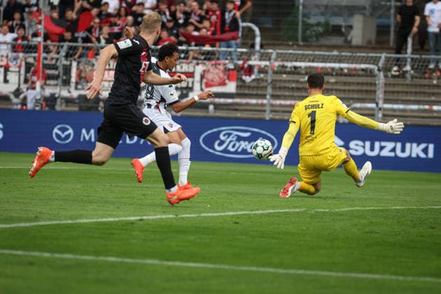 3rd Division, 2026–27 Season: Viktoria Köln vs. FC Ingolstadt 04; Nishan Velupillay (No. 28, FCI), Arne Schulz (No. 1, Viktoria Köln), Meiko Sponsel (No. 19, Viktoria Köln); Photo by Jürgen Meyer; 3rd Division, 2026–27 Season: Viktoria Köln vs. FC Ingolstadt 04