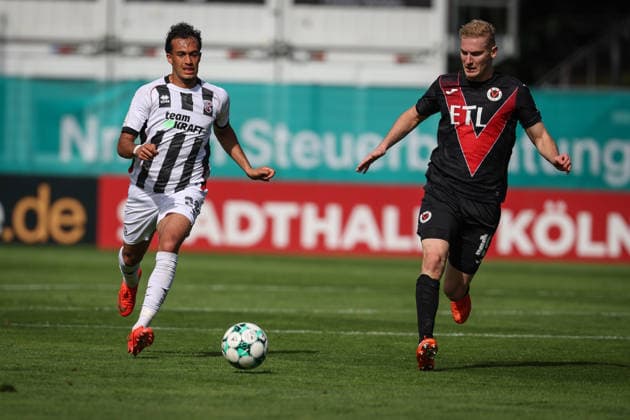 3rd Division, 2026–27 Season: Viktoria Köln vs. FC Ingolstadt 04; Nishan Velupillay (No. 28, FCI) and Meiko Sponsel (No. 19, Viktoria Köln); Photo by Jürgen Meyer; 3rd Division, 2026–27 Season: Viktoria Köln vs. FC Ingolstadt 04