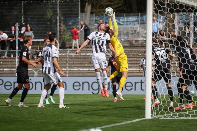 3rd Division, 2026–27 Season: Viktoria Köln vs. FC Ingolstadt 04; Lars Lokotsch (No. 13), FCI; Arne Schulz (No. 1), Viktoria Köln; Photo by Jürgen Meyer; 3rd Division, 2026–27 Season: Viktoria Köln vs. FC Ingolstadt 04
